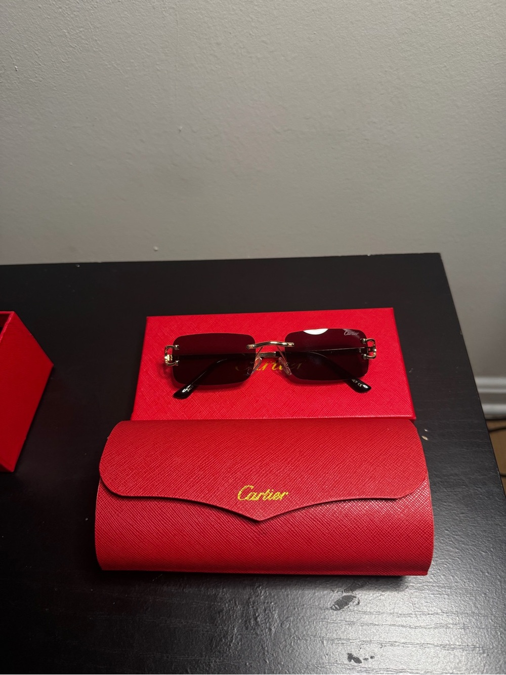 Cartier Women's Rimless Sunglasses with Burgundy Lenses and Gold Accents